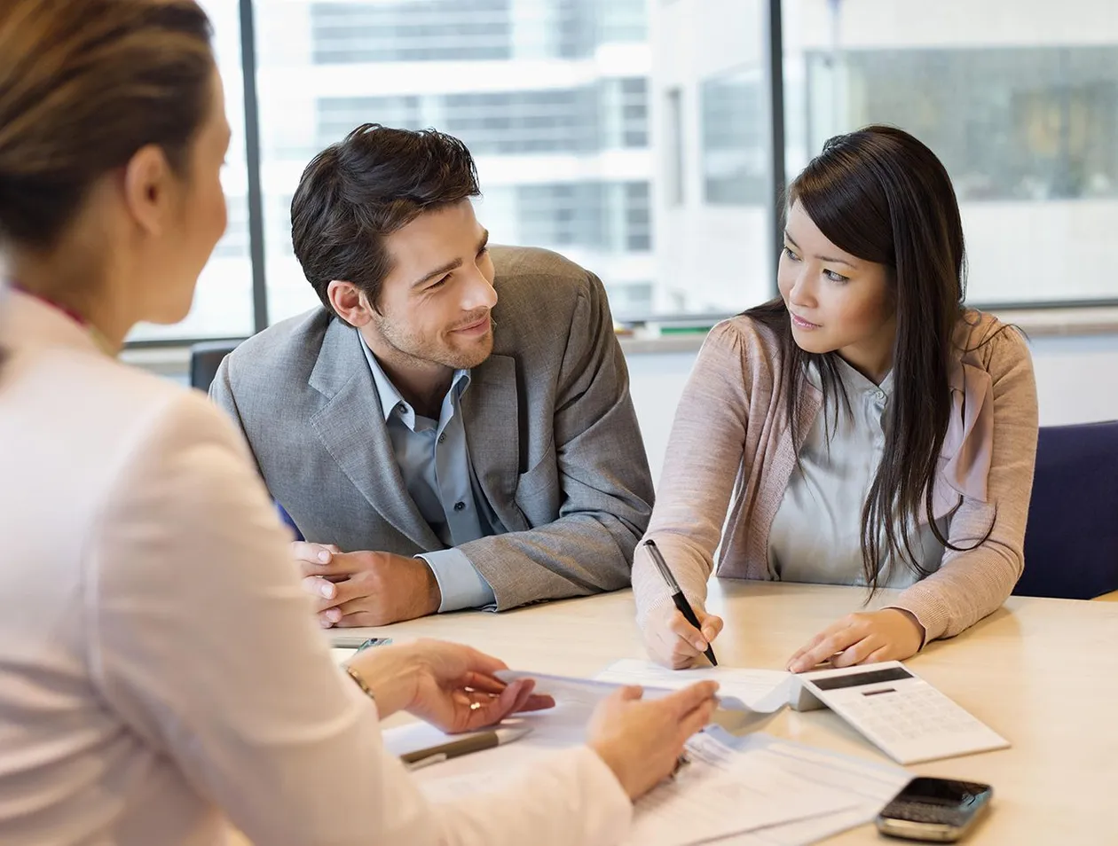 three people negotiating