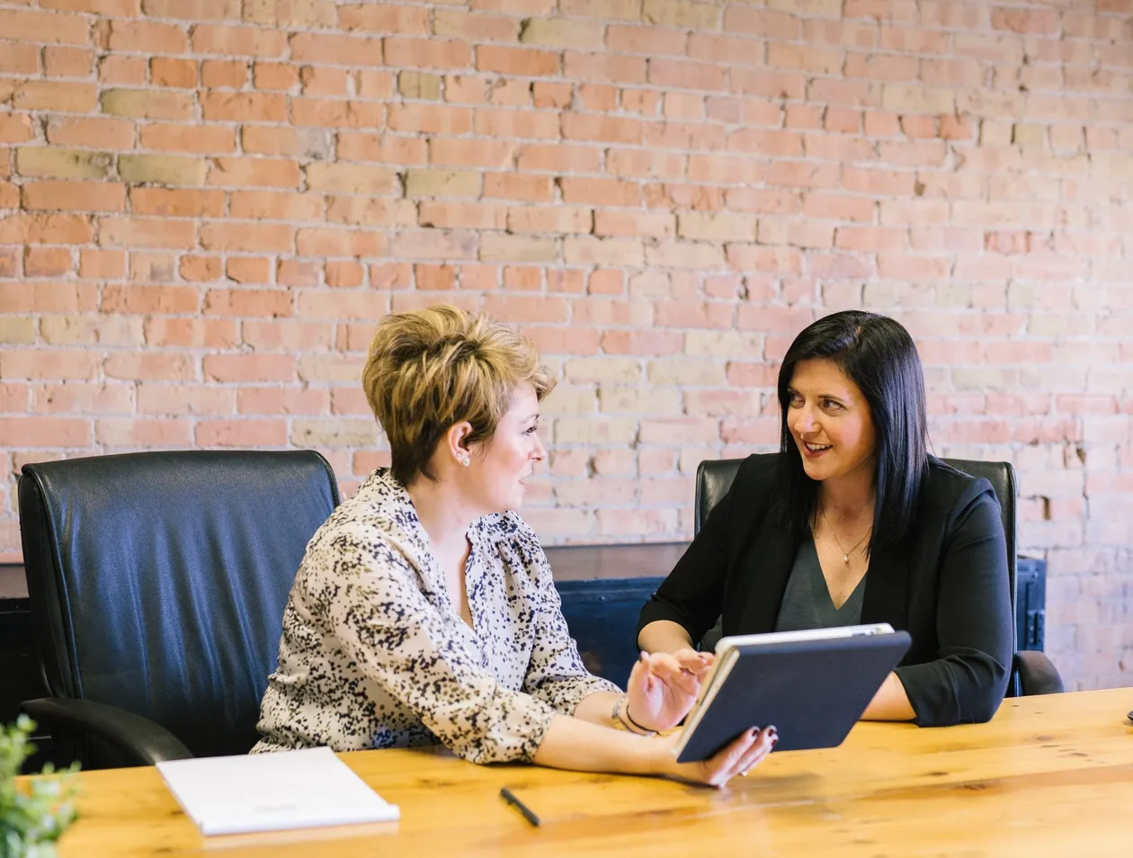 Two women looking over notes