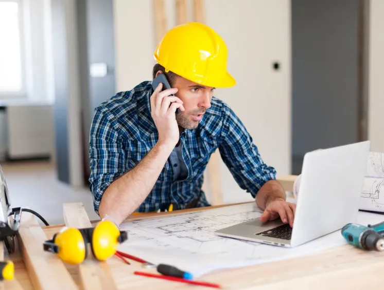 contractor looking at computer